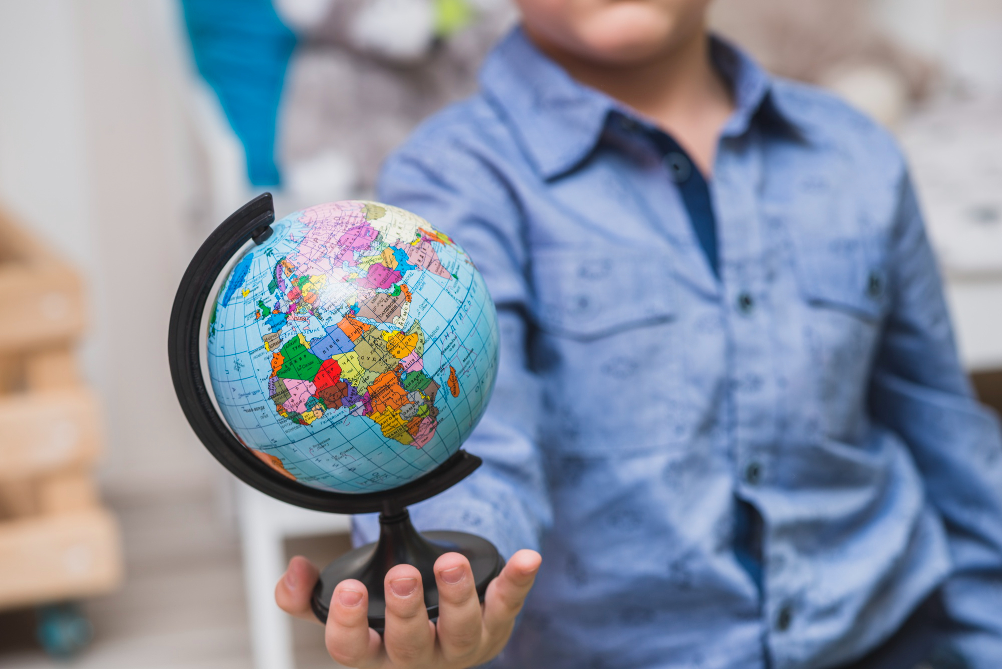 Person holding globe