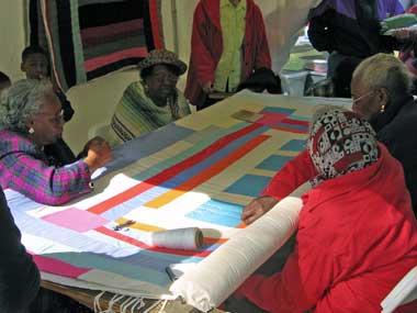 Women from Gees Bend work on a quilt Women from Gees Bend work on a quilt