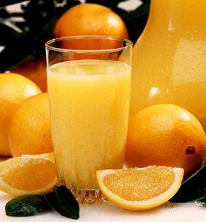 Orange juice and fresh oranges Orange juice and fresh oranges