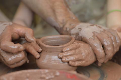 Clay as an art medium Child's hands in clay - official art medium of North Carolina