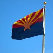 State Flag of Arizona waving against blue sky