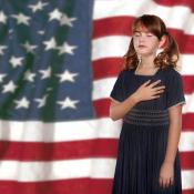 Child saying the pledge of Allegiance to United States