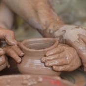 Child's hands in clay - official art medium of North Carolina