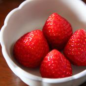 4 perfect strawberries in a bowl