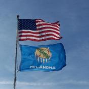 Oklahoma flag flying beneath American flag